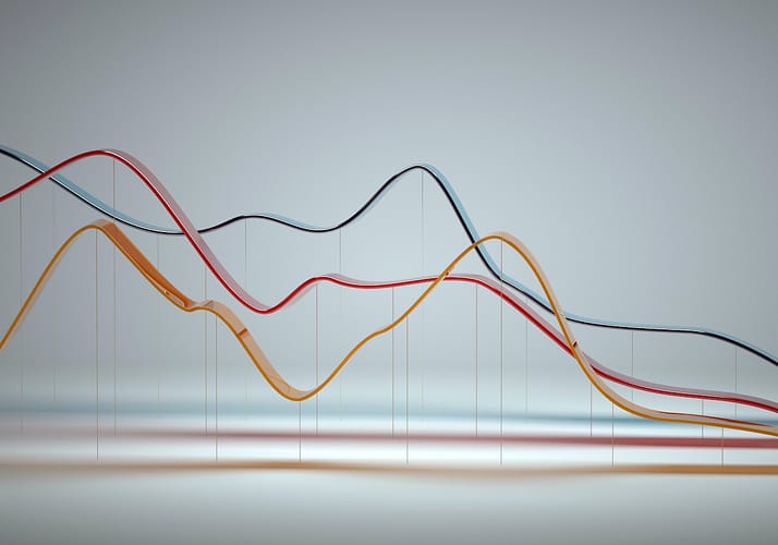 Digital generated image of abstract multi colored curve chart on white background.
