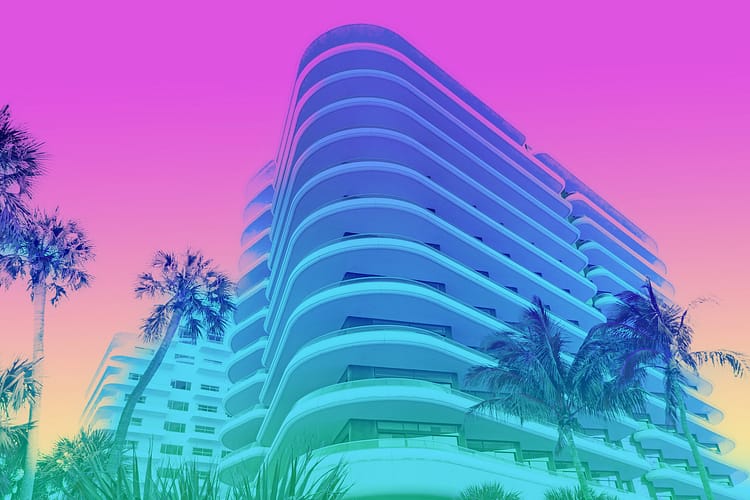 a photo of an art deco style building in Miami with pastel gradient colors